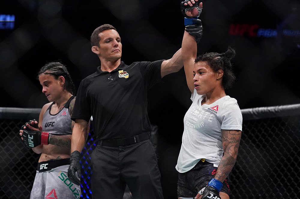 July 13, 2019; Sacramento, CA, USA; Brianna Van Buren (blue gloves) defeats Livinha Souza (red gloves) during UFC Fight Night-Sacramento at Golden 1 Center. Mandatory Credit: Kyle Terada-USA TODAY Sports