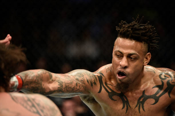 BOSTON, MASSACHUSETTS - OCTOBER 18:  (R-L) Greg Hardy punches Ben Sosoli in their heavyweight bout during the UFC Fight Night event at TD Garden on October 18, 2019 in Boston, Massachusetts. (Photo by Chris Unger/Zuffa LLC via Getty Images)
