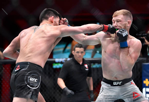 LAS VEGAS, NEVADA - MARCH 06: (L-R) Dominick Cruz punches Casey Kenney in their bantamweight fight during the UFC 259 event at UFC APEX on March 06, 2021 in Las Vegas, Nevada. (Photo by Chris Unger/Zuffa LLC)